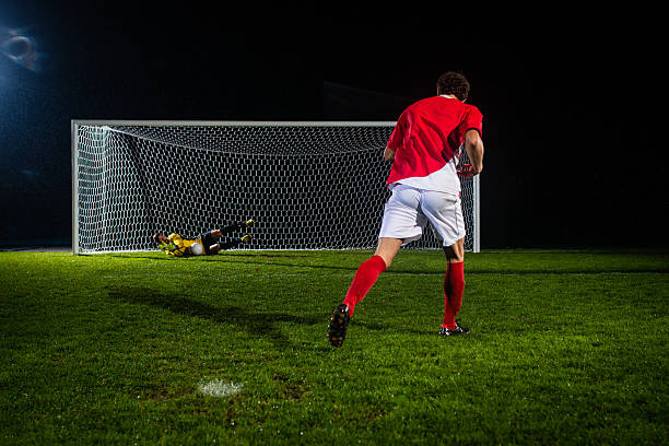 soccer player-shooting at goal - penalty soccer penalty shoot out goalie stock-fotos und bilder