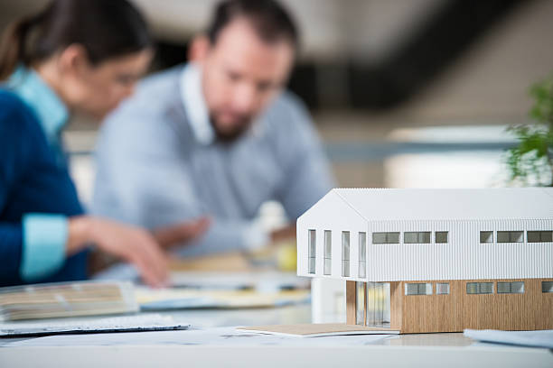 istock A male and female architect checking the details 467631790
