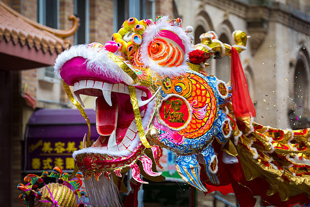 Traditional Chinese Dragon New Year, United States - February 2, 2014: Traditional Chinese Dragon parades at the Lunar New Year Festival in Chinatown. Chinese dragons are legendary creatures in Chinese mythology and Chinese folklore. chinese zodiac sign photos stock pictures, royalty-free photos & images