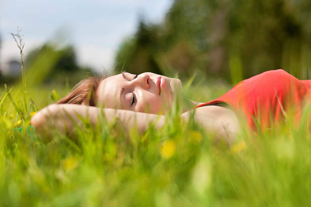 istock The woman lies on a grass 467634220