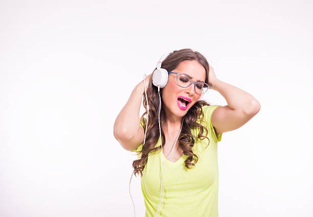 istock Young woman enjoying music 467634234