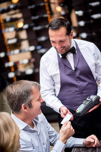 istock People paying for dinner at the restaurant 467634936