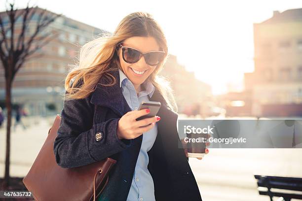 Cheerful Woman Using Smart Phone Stock Photo - Download Image Now - Smart Phone, 2015, 30-39 Years