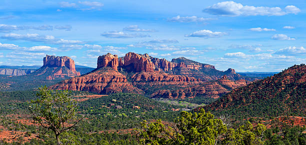 Cathedral Rock Panoramic view to red rocks near Sedona and the Village of Oak Creek, with lush green forests and bushes in front. The rocks are named Cathedral Rock and Castle Rock. red rocks state park arizona photos stock pictures, royalty-free photos & images