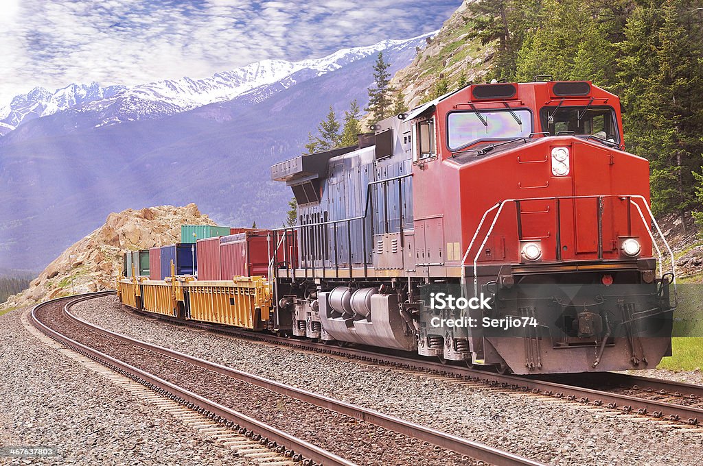 A colorful freight train on a nice day Freight train in Canadian rockies.  Canada Stock Photo