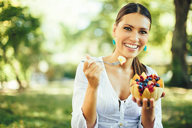 Pretty beauty eating fruit salad