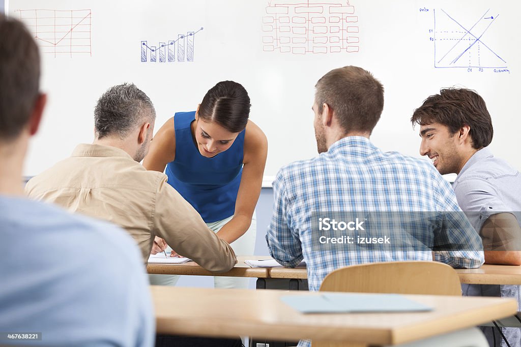 Training Group of people attending a job training, working together. Classroom Stock Photo