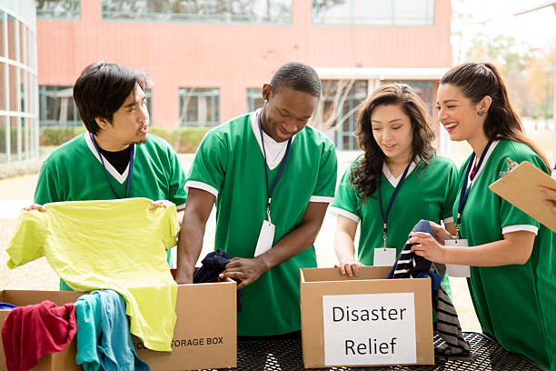 istock Volunteers: College students collect clothing donations for disaster relief. 467638227