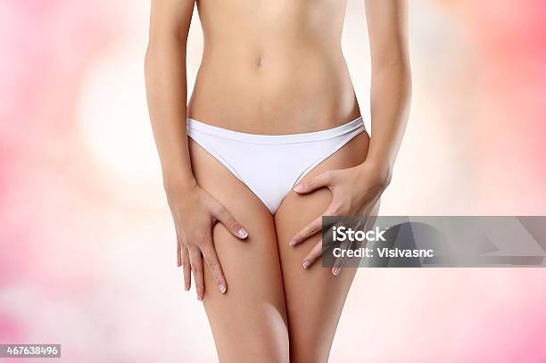 Woman Abdomen On Pink Background Stock Photo - Download Image Now - Uterus, Women, 2015