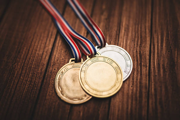 istock championship medals on plank wood 467639417