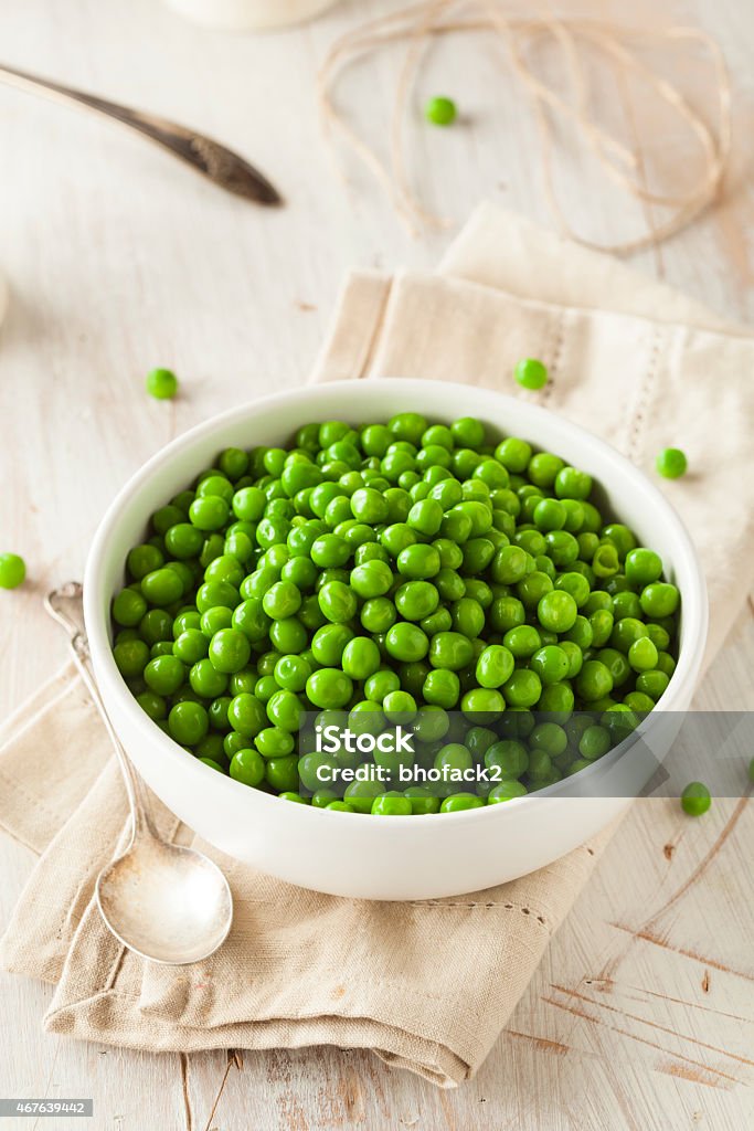 Organic Steamed Fresh Green Peas Organic Steamed Fresh Green Peas in a Bowl 2015 Stock Photo