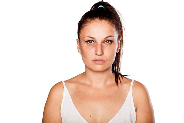 istock Young woman with poor makeup posing on white background 467640356