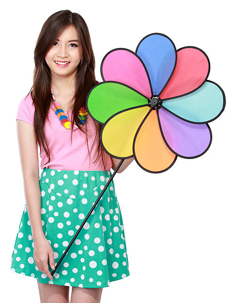 A delightful close-up shot of a vibrant bouquet of colorful plastic pinwheels, their multiple petals and dynamic colors creating a joyful, festive and playful mood.