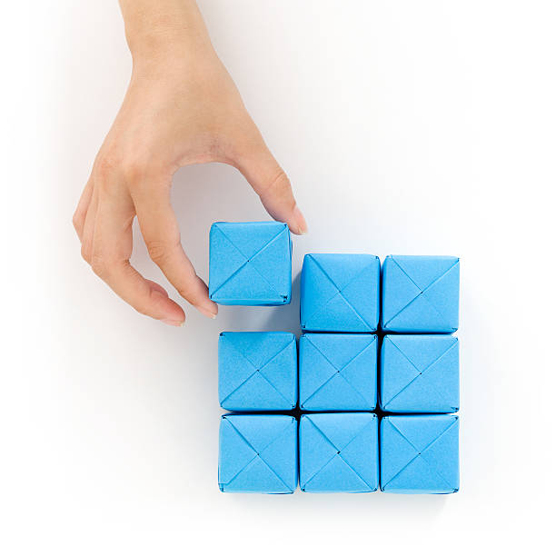 aggiunta di un cubo blu - craft block concepts square shape foto e immagini stock