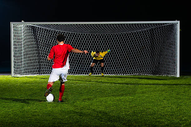 istock Soccer Player Shooting At Goal 467643474
