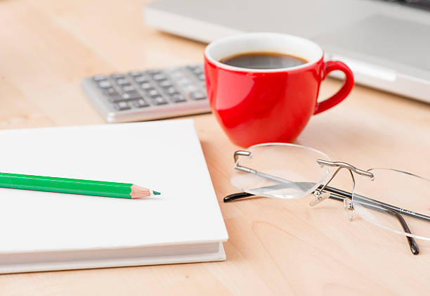 istock Coffee cup and laptop at office 467643716