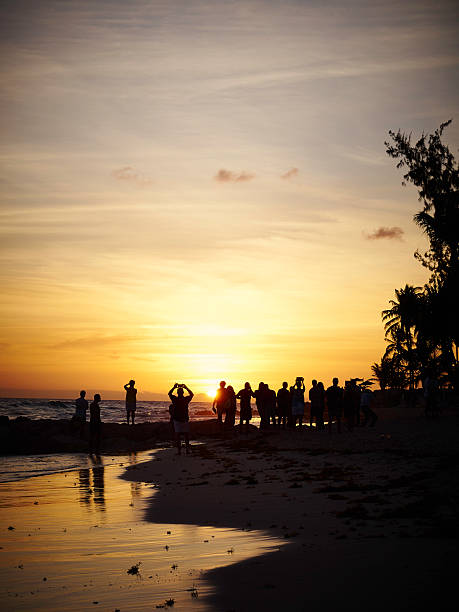 istock Silhouette of people watching sunset 467644540