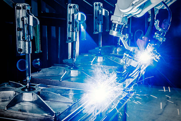 istock Welding robots in a metal manufacturing plant 467644945