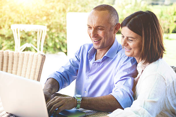 istock Adult couple surfing the net on computer 467645113