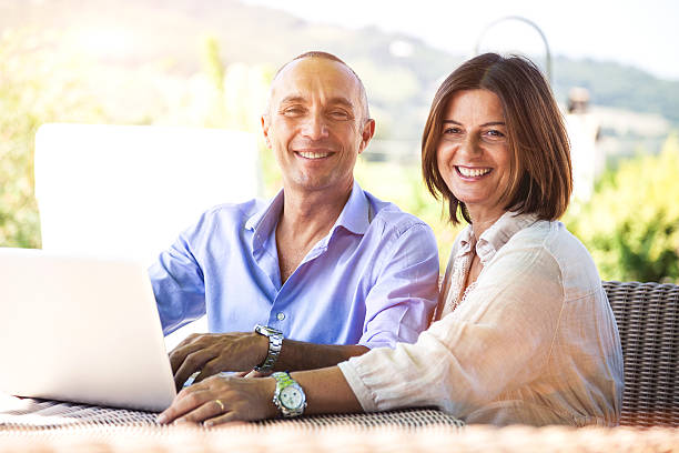 istock Adult couple surfing the net on computer 467645147