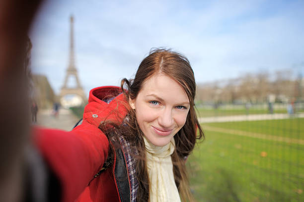 istock Woman taking selfie near the Eiffel tower 467645902