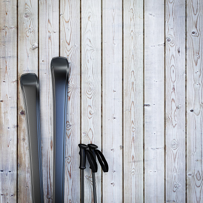 black blank skis on wooden planks wall