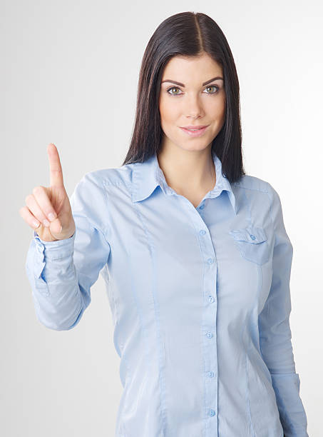 istock Woman touching imaginary screen by her finger 467646803