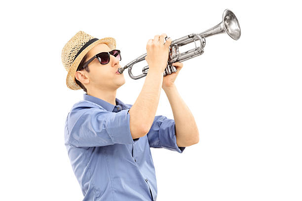 istock Young male musician playing trumpet 467648083