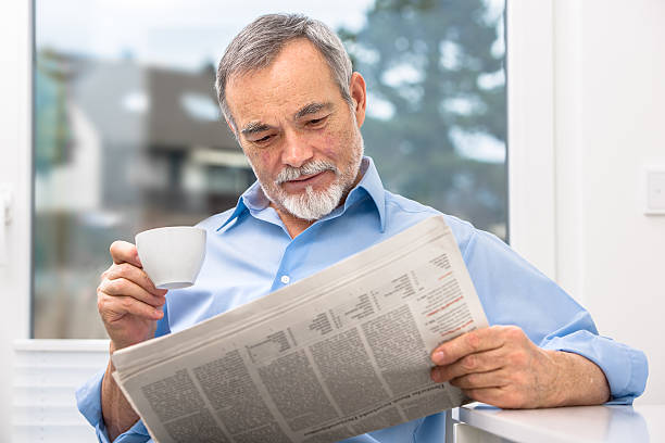 istock Senior man with newspaper 467648489