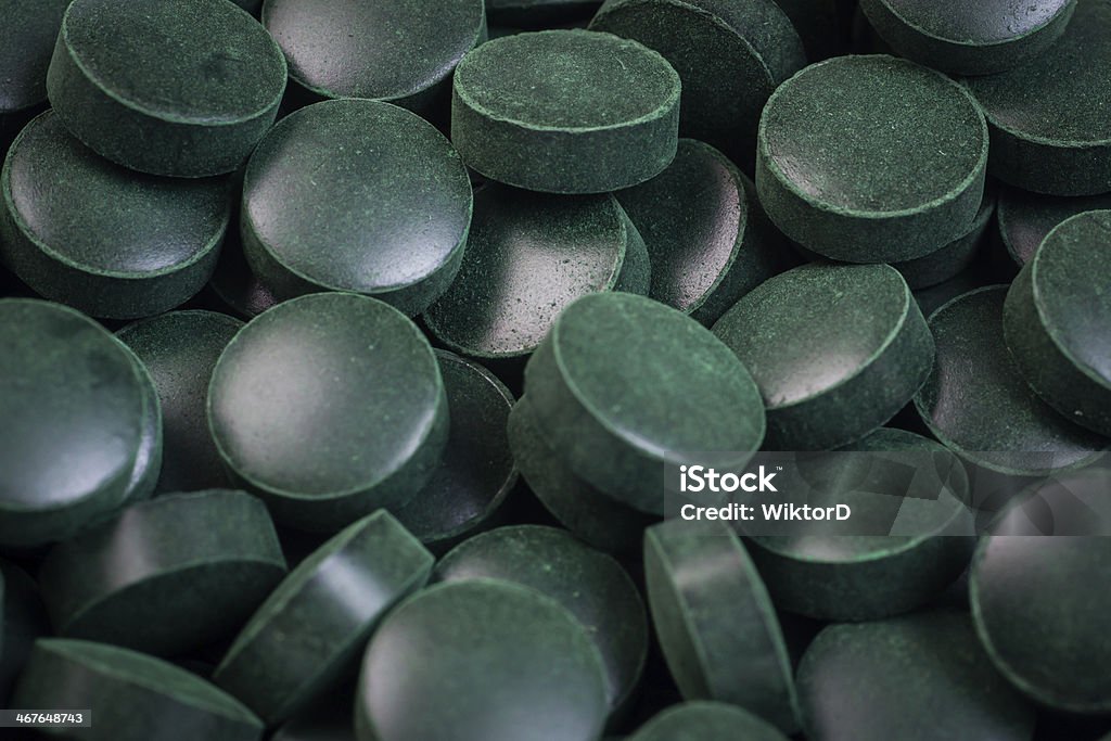 Green pills, spirulina Algae Stock Photo