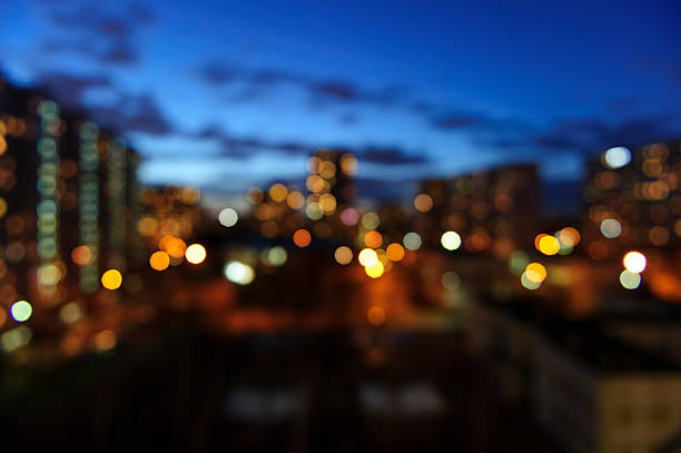 Blurred cityscape Blurred summer evening city buildings lights - window view background adobe material photos stock pictures, royalty-free photos & images