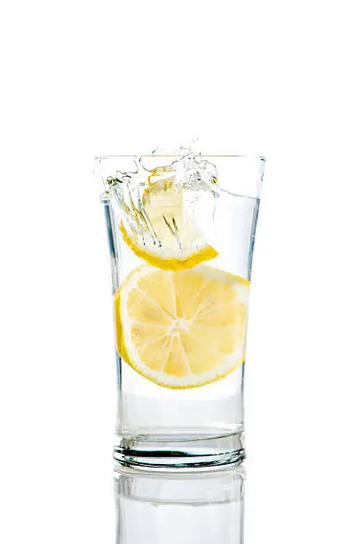 Splashing lemons in a glass of water