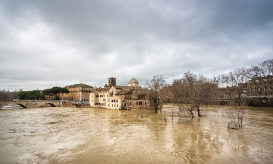 Isola Tiberina and a flooded  Tiber, Rome Italy
