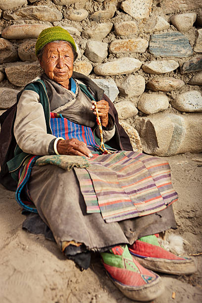 istock Tibetan woman with rosary 467657487