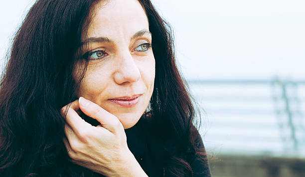 istock Beautiful Woman on Pier in Winter 467657609