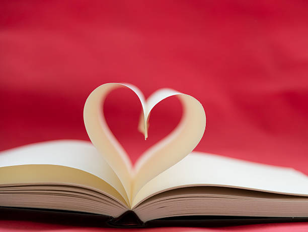 heart Opened book with heart shape of pages. book heart shape valentines day copy space stock pictures, royalty-free photos & images