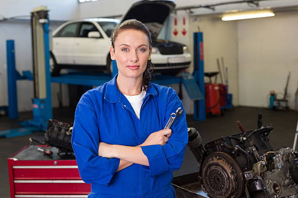 istock Mechanic looking at camera holding wrench 467658890
