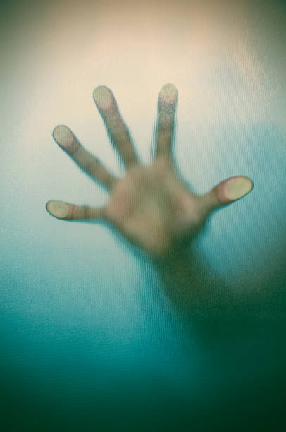 istock Blurry hand behind matted glass in vintage tone 467659886