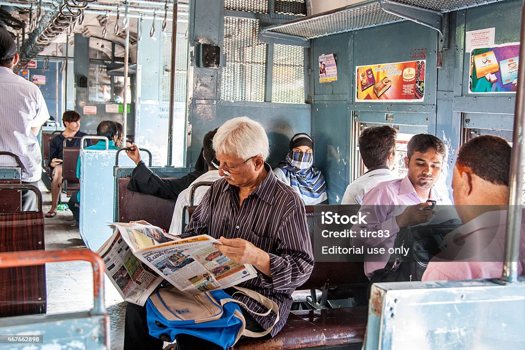 People travelling on local Mumbai train Mumbai, India - November, 5 2010: Interior of Indian Railways carriage showing people travelling from Bandra West to Mumbai Mumbai Stock Photo