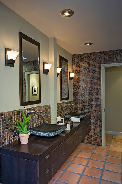 istock Lamps By Mirrors Over Sinks In Bathroom 467672224