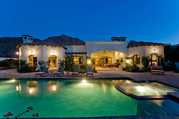 istock Illuminated House With Pool At Dusk 467672266