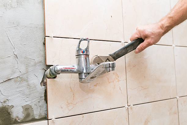 istock Water fixing - plumber hands with wratch fix tap 467674494