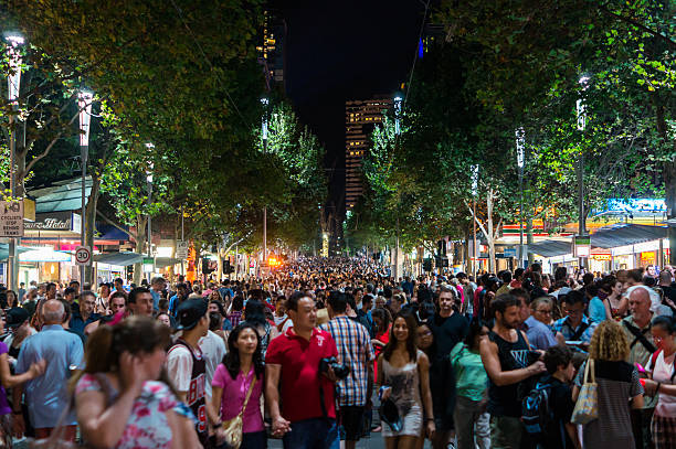 Crowded Melbourne street a White Night A crowd in Swanston Street, Melbourne during the 2015 White Night arts festival. melbourne street crowd stock pictures, royalty-free photos & images