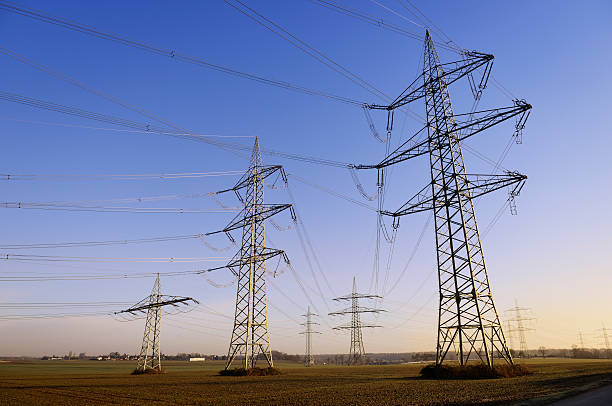 istock Small group of electricity pylons at dawn 467678910