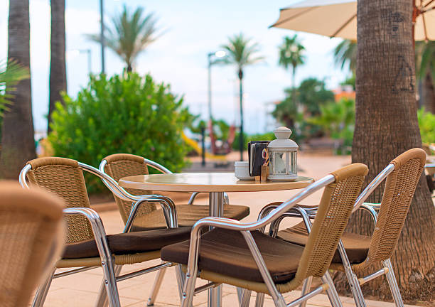 istock Mediterranean cafe terrace exterior with chairs. 467679348