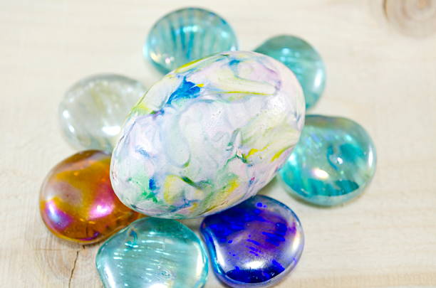 istock Hand painted egg on colorful pearls 467679492