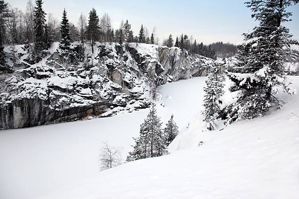 istock Winter snowfall in old marble quarry, Karelia, Russia 467681250