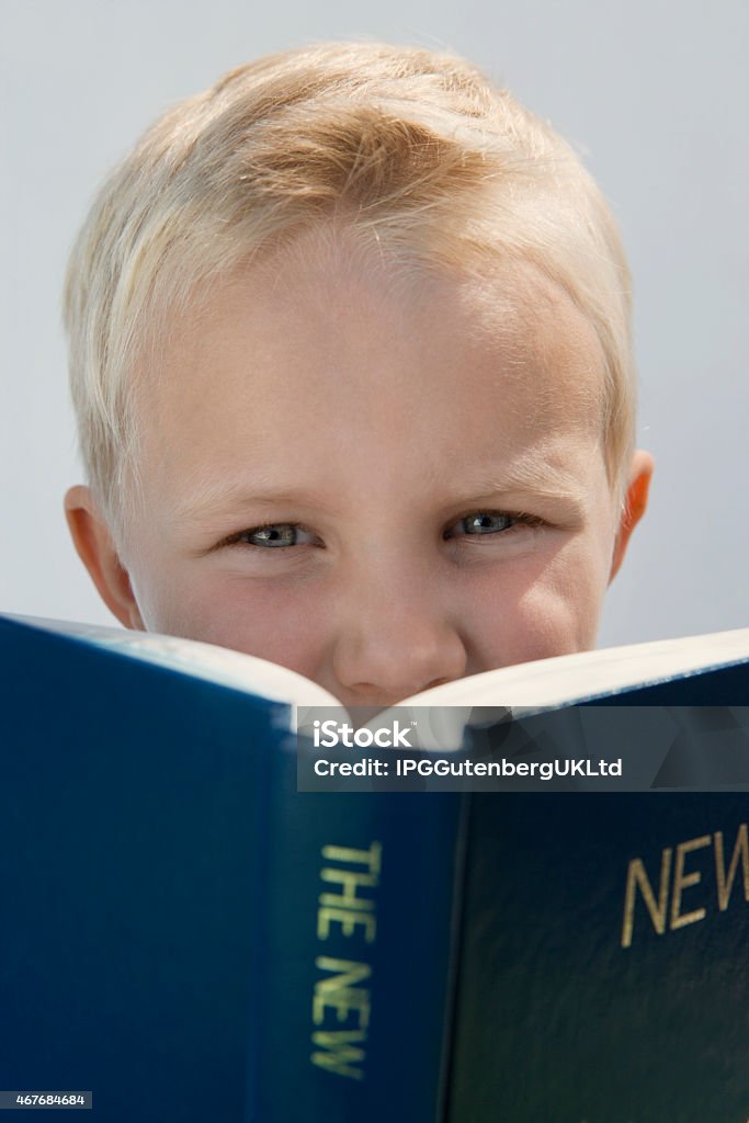 Child portrait Boy Reading The New Testament 2015 Stock Photo