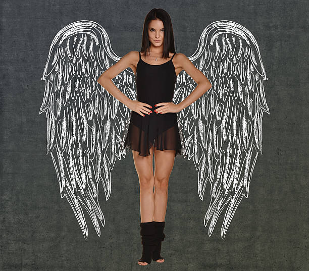 istock Dancer girl with wings drawing on the wall 467685552