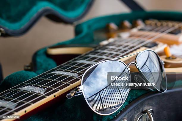 Sandy Guitar With Sunglasses Stock Photo - Download Image Now - 2015, Beach, Black Color